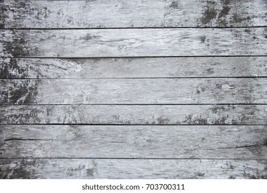 Wooden old painted white and grey shabby background, natural old rustic wood texture floor element with close up top view from above, copy free space for text, gray aged cracked rough thin planks
