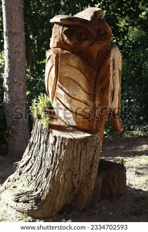 Wooden owl in a park