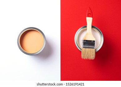 Wooden paint brush, open paint cans on trendy red and white background. Top view, copy space. Appartment renovation, repair, building and home design concept - Powered by Shutterstock