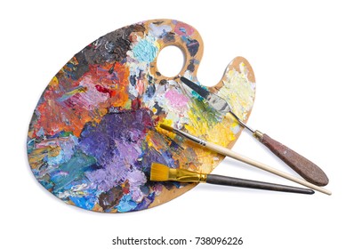 Wooden palette for oil paints with brushes and palette knife isolated on white background. Top view. - Powered by Shutterstock
