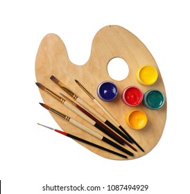 Wooden palette with paints and brushes on white background, top view - Powered by Shutterstock