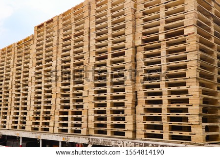 Wooden pallets stack at the freight cargo warehouse for transportation and logistics industrial
