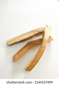wooden palo santo sticks on a white background, incense set