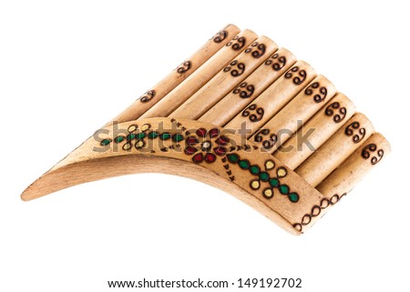 a wooden pan flute isolated over a white background