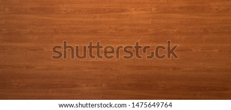 Wooden panel background texture with a decorative red woodgrain pattern for use in carpentry, interior decor and building