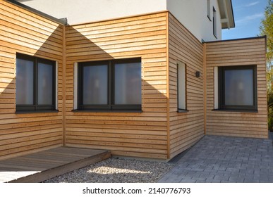 Wooden Paneles Natural Modern New House With Windows In Summer Sunny Day