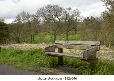Wooden park bench in the park. - Shutterstock ID 1326646