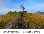 Wooden path leading towards the Cape Horn Memorial Sculpture on Cape Horn Island, the southernmost point of South America in Chile