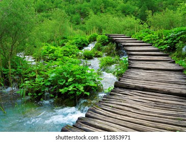 Wooden path and waterfall in Plitvice National Park, Croatia - Powered by Shutterstock