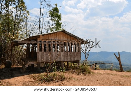 Wooden pavilion house or wood pavillion home at rest point between journey to Ban Taphoen Khi Karen Village on top Khao Thewada mountain in Phu Toei National Park at Suphanburi in Suphan Buri Thailand