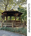 A wooden pavilion perfect for relax and rest after walks around the garden in Kobe, Japan