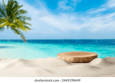 Wooden pedestal with free space for your decoration on tropical summer sand beach