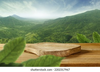 Wooden pedestal on table and green landscape of mountains.  - Shutterstock ID 2202317967