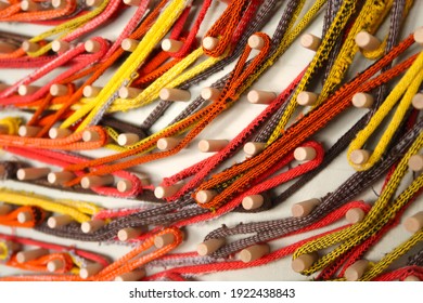 Wooden Peg Board Wrapped With Colorful Fabric Loops                               