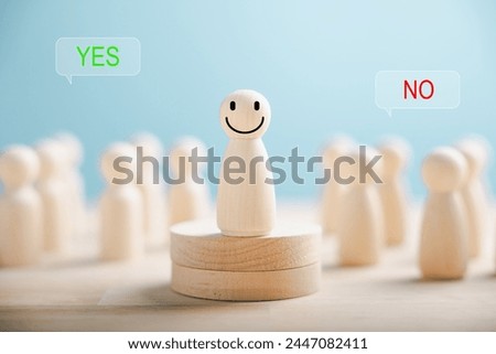 Wooden peg dolls on cube show yes or no symbols. Illustrates open-mindedness in elections with volunteers candidates and electorates. Think With Yes Or No Choice.