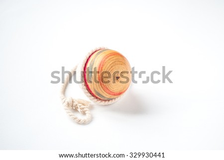 Wooden Pegtop on a White Background