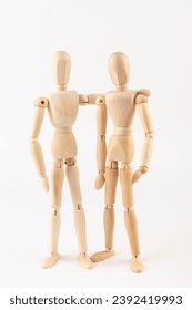 Wooden people hugging. People relationship concept. Friends.Wooden puppet Used for modeling human gestures.