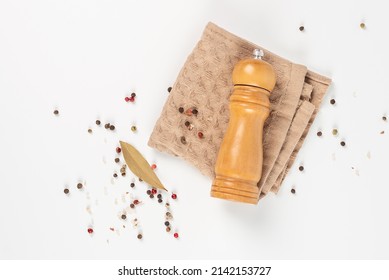 Wooden Pepper Grinder On A Light Background