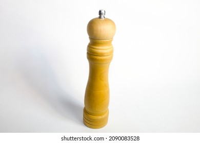 
Wooden Pepper Grinder With White Background.