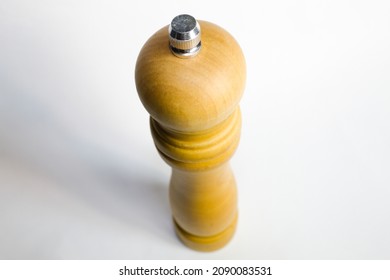 
Wooden Pepper Grinder With White Background.