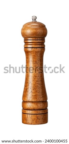 Wooden pepper mill placed against a white background. 