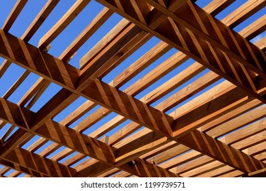 Wooden Pergola In The Sun With Blue Sky