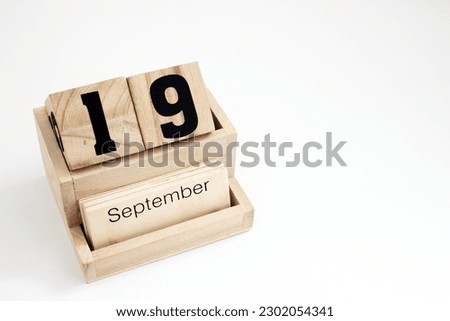 Wooden perpetual calendar showing the 19th of September Foto d'archivio © 