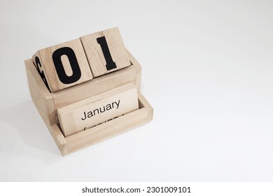 Wooden perpetual calendar showing the 1st of January - Powered by Shutterstock