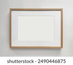 Wooden photo frame A4 size with White Photo Mat, horizontal artwork on a white wall, front view. High quality photo