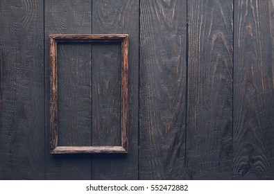 Wooden Photo Frame On Old Wooden Wall