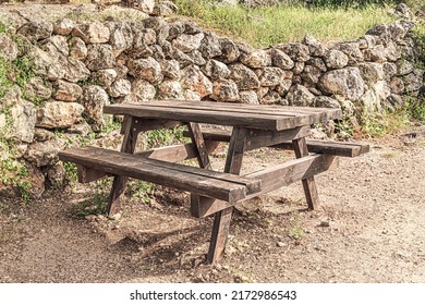wooden picnic table in a park