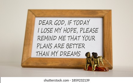 Wooden Picture Frame With Inspirational Quote - 'Dear God, If Today I Lose My Hope, Please Remind Me That Your Plans Are Better Than My Dreams' On Beautiful White Fon. Two Bronze Angeles On The Table.