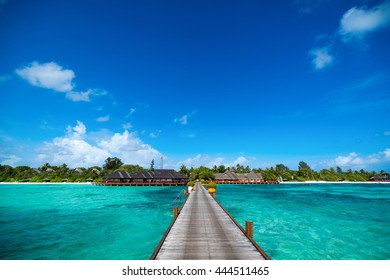 Wooden Pier With Blue Sea And Sky Background