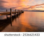 Wooden Pier and Clouds Reflecting on Lake Tahoe at Sunrise, South Lake Tahoe, California, USA