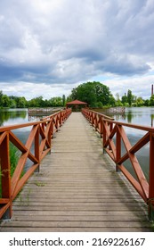 Wooden Pier And Gazebo On The Pond