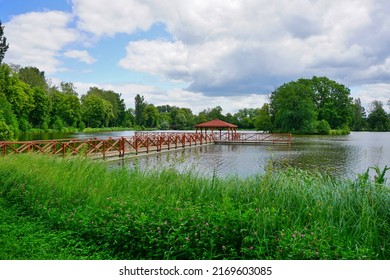 Wooden Pier And Gazebo On The Pond