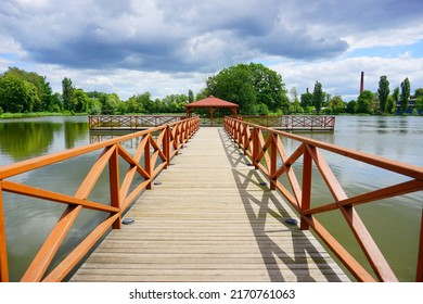 Wooden Pier And Gazebo On The Pond