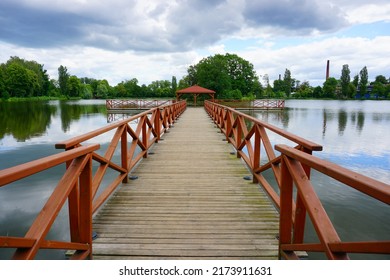 Wooden Pier And Gazebo On The Pond