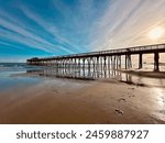 Wooden pier into ocean in the Myrtle Beach State Park,  Horry County, South Carolina. Fishing pier