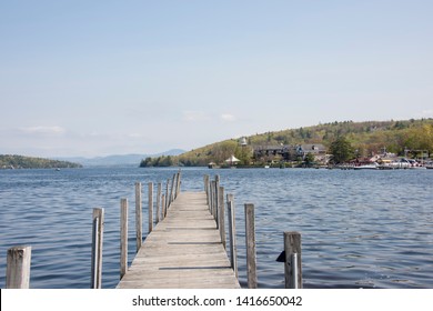 Wooden Pier On Lake In Quaint New England Town