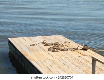 wooden pier with a rope - Shutterstock ID 142820704
