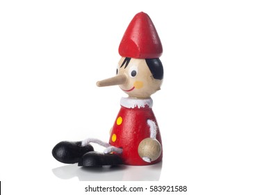 Wooden Pinocchio Doll Isolated On White Background.