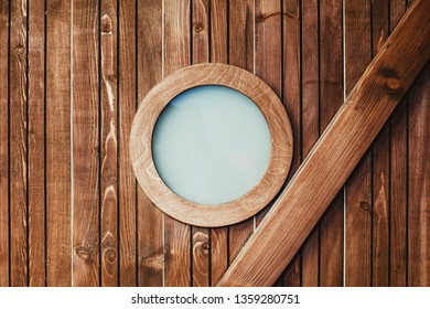 Wooden Pirate Ship Cabin. Round Frame Glass Window. Vintage Room Background. Circle Of Wood With Glass Inside.