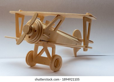 Wooden plane on plain background