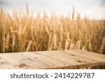 Wooden Plank Empty Table For Products Display With Blurred Wheat Field and Blue Sky Background. High quality photo