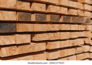 Wooden planks and beams. Air-drying timber stack. Wood air drying. Wood for house construction. Building material. Wood warehouse