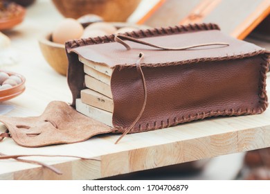 Wooden Planks In The Leather Bag On The Wooden Table. Handmade