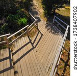 A wooden platform with handrail leading to one of the paradise beaches in Virgin Gorda, British Virgin Island