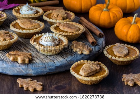 Similar – Kürbiskuchen in einem Tablett und einer separaten Kuchenscheibe