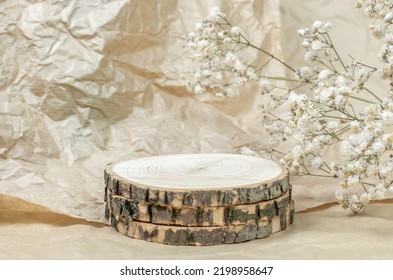Wooden Podium For Advertising Environmentally Friendly Cosmetics. Showcase For Cosmetic Products And Gypsophila Bouquet, Mockup